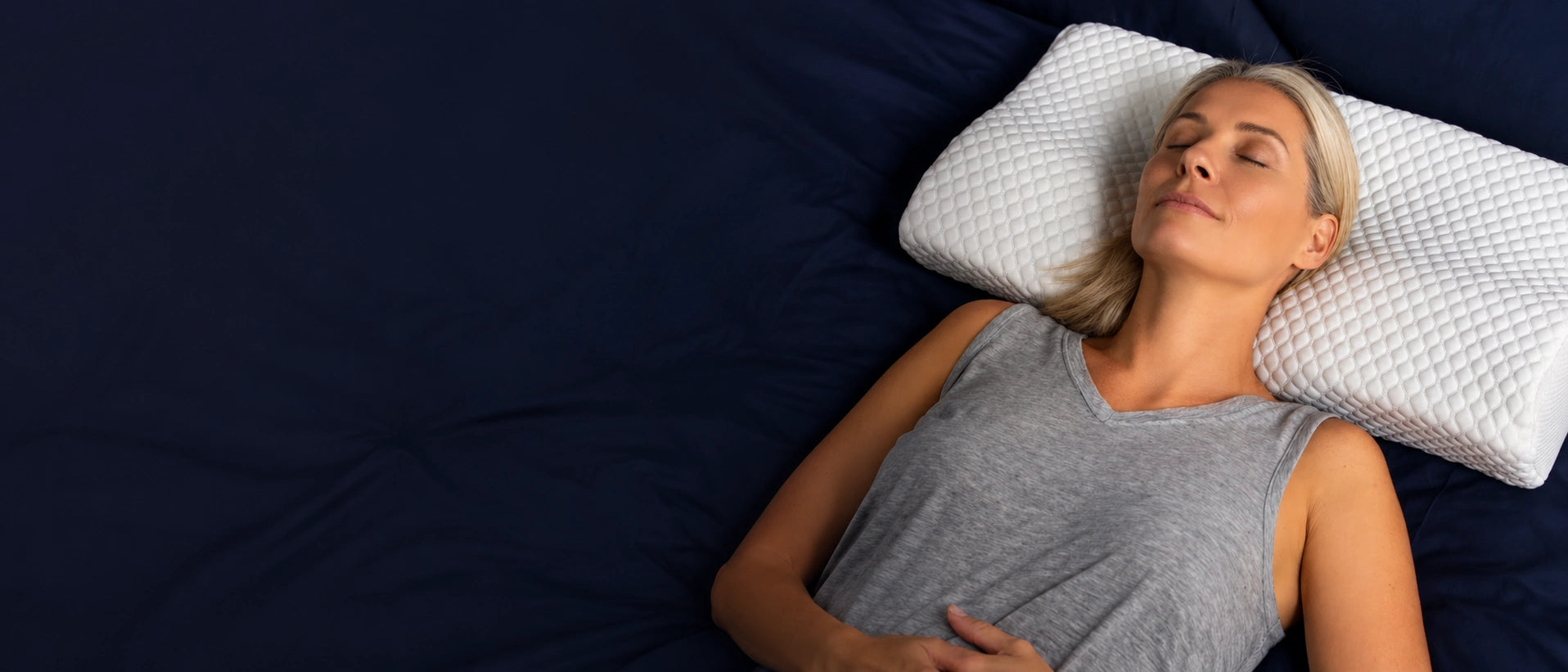 Woman sleeping comfortably on a BetterRest pillow